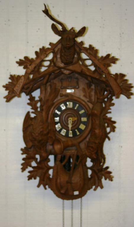 UNUSUAL OVERSIZED BLACK FOREST CARVED CUCKOO CLOCK: WITH DEER HEAD, APPROX. 39" H, 25" H, SIGNED CHR. HENSSLER DORNSTETTEN, MISSING ANTLER