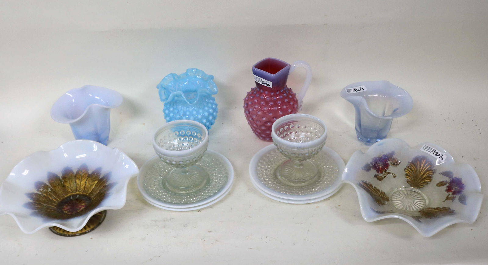 TWELVE PIECES OF OPALESCENT GLASS: INC CRANBERRY PITCHER W/ APPLIED HANDLE, TWO OPALESCENT GOOFUS STYLE BOWLS, PR OF MATCHING VASES, MISC. HOBNAIL PIECES AND AN OPALESCENT RUFFLE TOP VASE, 2 1/2" TO 6" H.