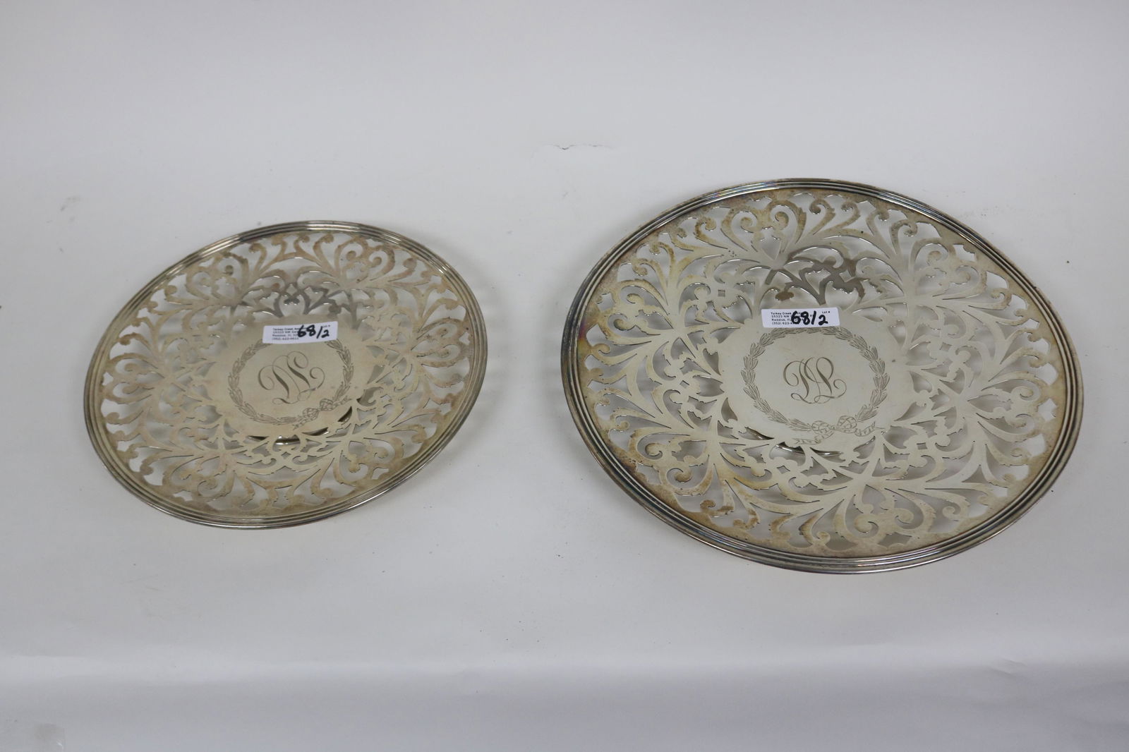 TWO GORHAM STERLING SILVER TRAYS: WITH OPENWORK DESIGN, 3/4" TO 1" H. 9" TO 11" DIA/. 18.12 OZT. BOTH MONOGRAMMED.