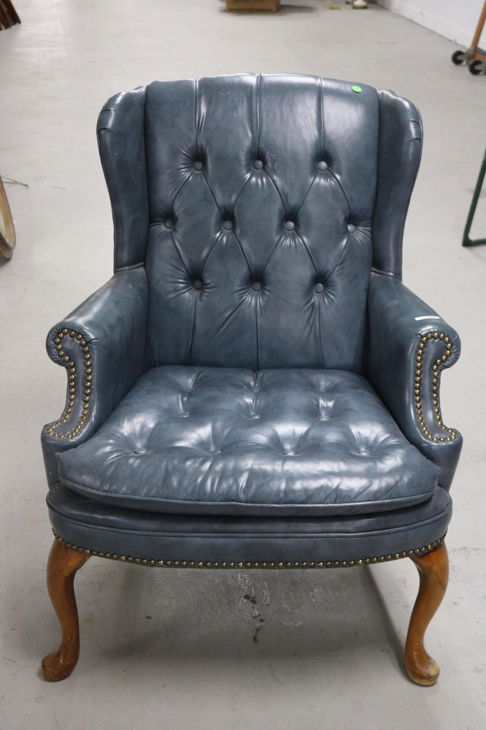 FAUX LEATHER ARMCHAIR: IN BLUE WITH BRASS TACKS AND CABRIOLE LEGS, 37" H, 28" W, 26" D. SEAT H, 17".