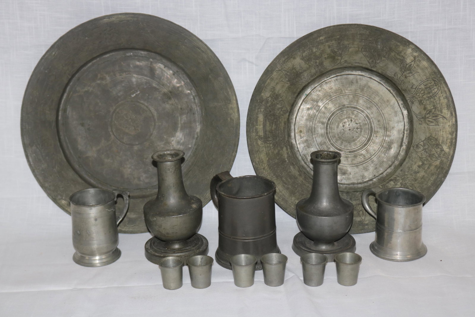 GROUP OF PEWTER: INCLUDING TRAYS, VASES, MUGS AND SHOT GLASSES, 1 1/2" TO 6 3/4" H, 1 1/2" TO 14" DIA.