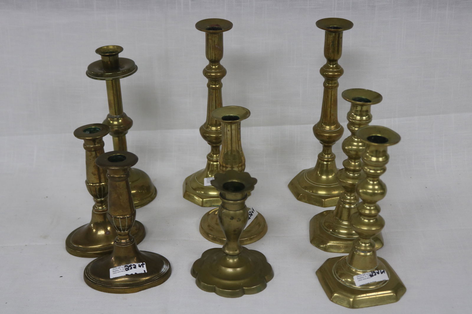 THREE PAIR OF BRASS PUSH UP CANDLESTICKS (1 of 3)