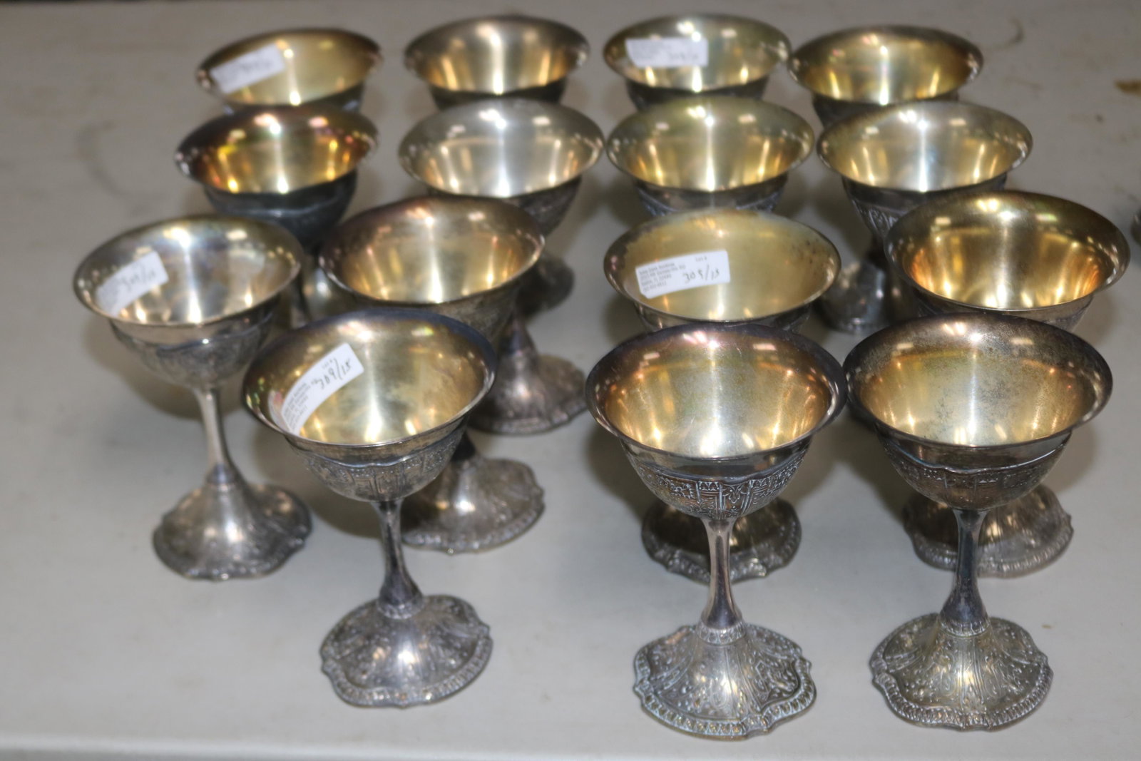 FIFTEEN SILVER PLATED WINE GOBLETS: WITH ORNATE DESIGN, 5" H, 3 1/2" DIA.