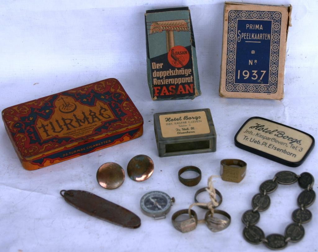 COLLECTION OF 10 MISC. WAR SOUVENIRS TO INCLUDE: RINGS FROM AFRICA & THE PACIFIC, NAZI BRACELET, JAPANESE KNIFE & COMPASS & 2 BRASS BUTTONS