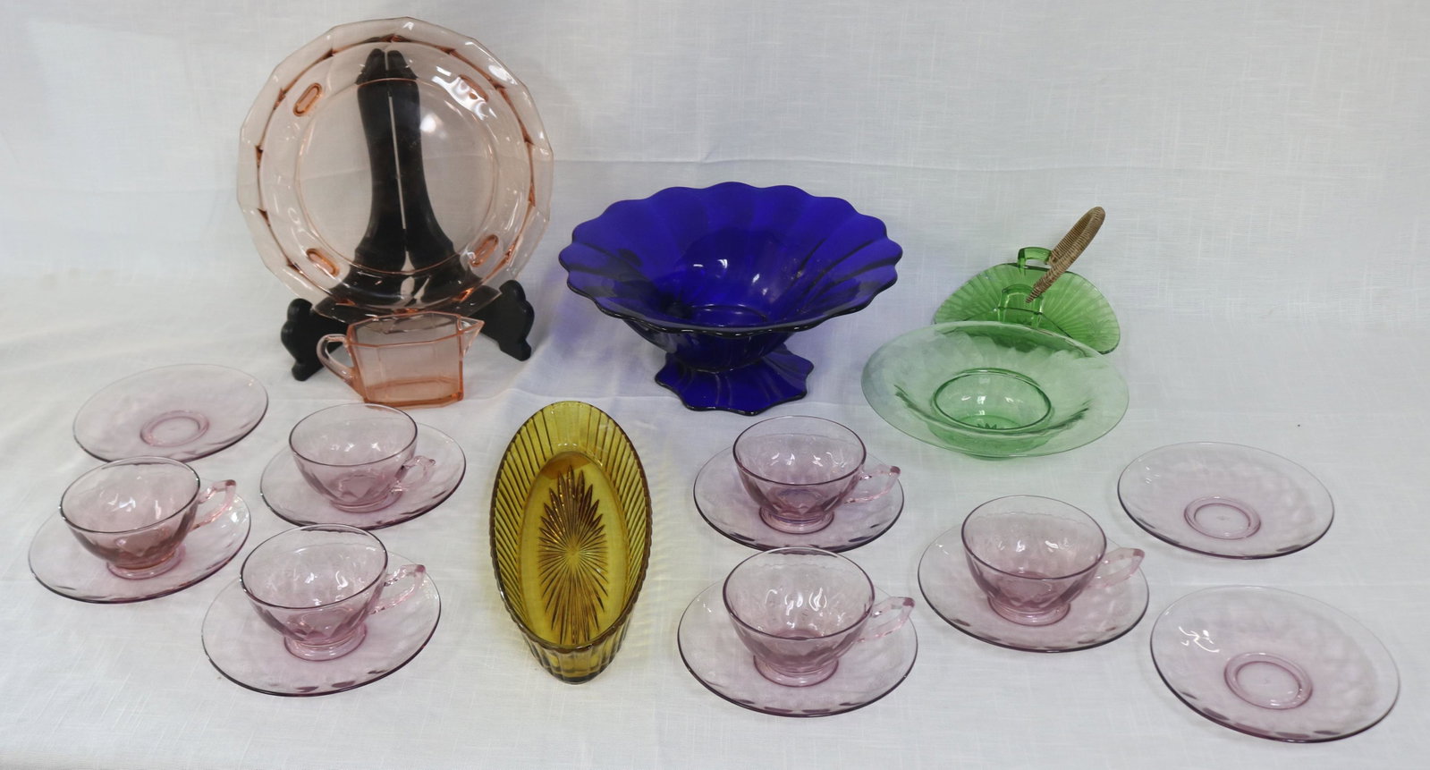 COLORED HEISEY LOT, 21 PCS; PINK, COBALT, GREEN,: AMBER, PURPLE, TRAY, PICKLE TRAY, HANDLED BASKET, CREAMER, CUPS & SAUCERS, ETC. 1" - 4 1/2" H, 4 3/4" - 11" DIA.