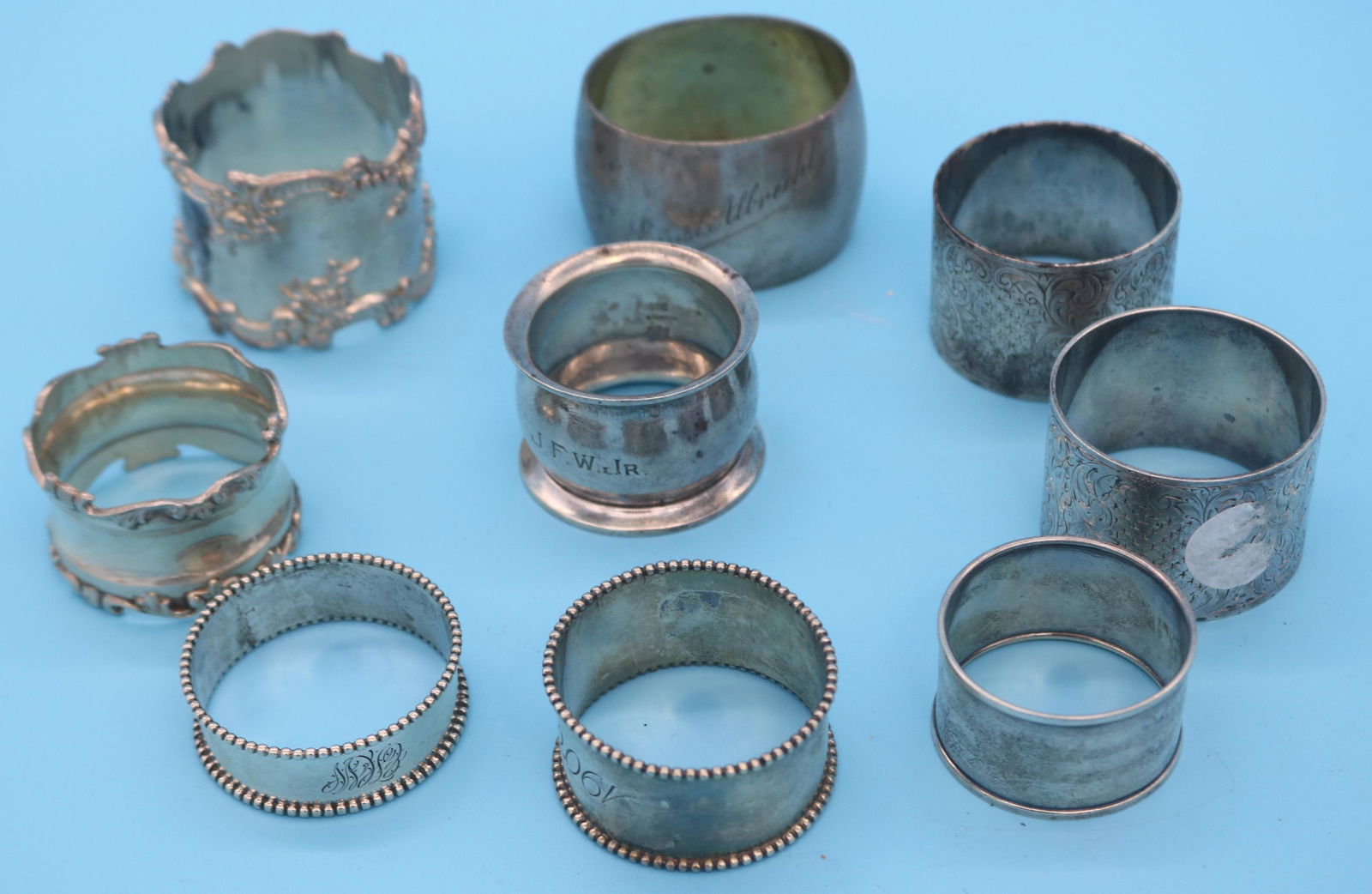 9 STERLING SILVER NAPKIN RINGS, 9.11 OZT: SEE PHOTO