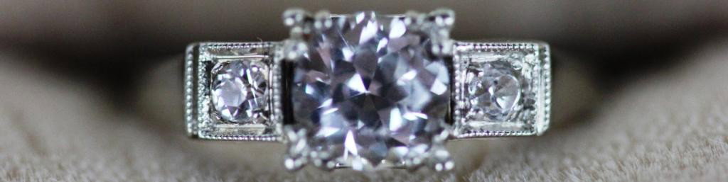 14K WHITE GOLD ACID TESTED DIAMOND RING,: LARGE STONE APPROX. .75 CARAT, WITH 2 SIDE DIAMONDS, APPROX SIZE 6, TOTAL WEIGHT 3.1 GRAMS