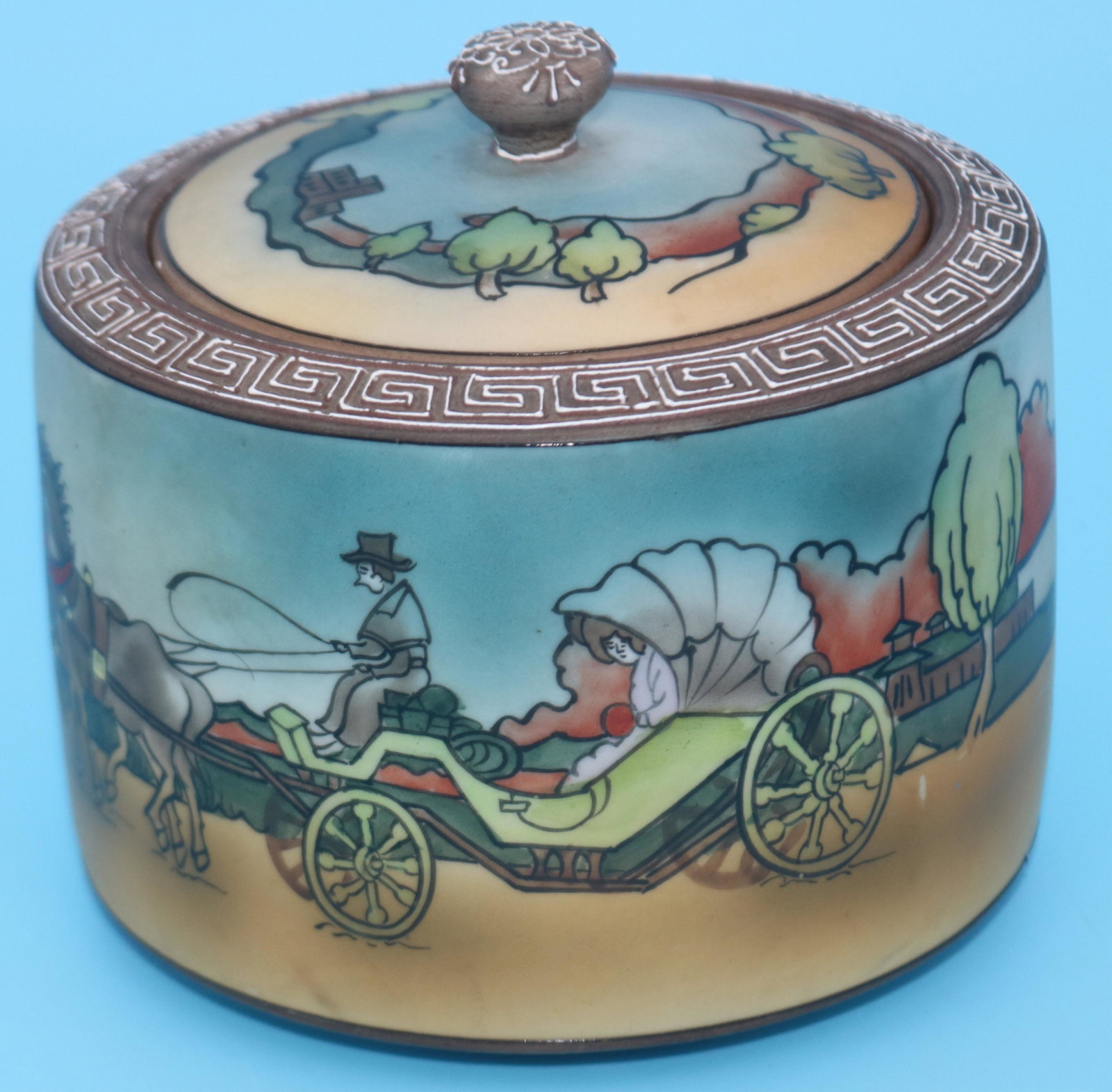 NIPPON TOBACCO JAR WITH HORSE & CARRIAGE DESIGN,: POSSIBLY IN MAKING REPAIR TO HANDLE, 5 1/2" H, 5 3/4" DIA.