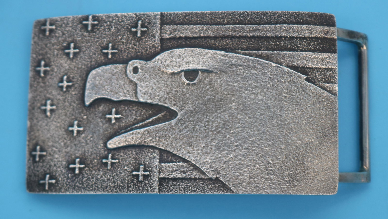 CAST SILVER BELT BUCKLE SIGNED DARYL D. BEGAY: ENTITLED "FREEDOM" SHOWS, FLAG & EAGLE, 2" H, 4" W, 3.45 OZT.