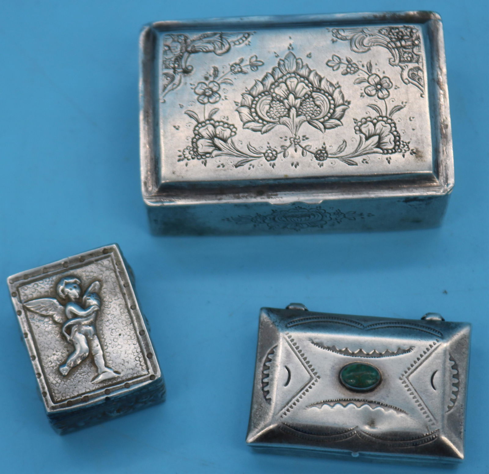 3 SMALL SILVER BOXES, ITALIAN BOX WITH CHERUB,: 1/2" H, 3/4" W, 1 1/8" H, ENGRAVED BOX 3/4" H, 2 1/4" W, 1 1/2" D, NAVAJO BOX WITH TURQUOISE 3/8" H, 1 1/2" W, 1" D, 2.87 OZT