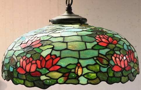 EARLY 20TH C. LEADED GLASS HANGING LAMP: WATER LILY DESIGN, BY HANDEL, ORIGINAL HANGING CHAIN AND FITTER, 24 1/2 DIA., 10 1/2" H, SHOWS SEVERAL CRACKS IN PANEL"