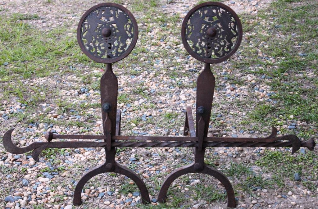4 PC. WROUGHT IRON FIREPLACE SET,: TO INCLUDE WROUGHT IRON & BRASS ANDIRONS WITH LION MOTIF, AND 2 WROUGHT IRON TOOLS, 30 H, 25" L, LARGE TOOL 46""