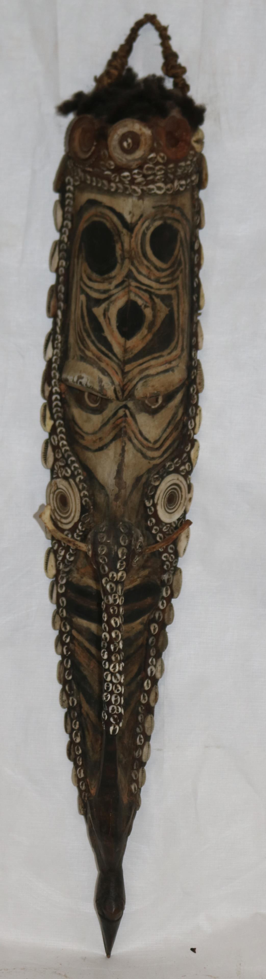 PAPUA NEW GUINEA CARVED & POLY CHROME PAINTED: SHIELD WITH COWRIE SHELL INLAY, 29" H, 5" W