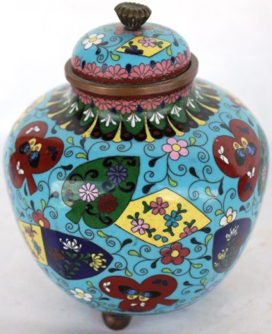 CLOISONNE FOOTED GINGER JAR WITH: BUTTERFLY & FLORAL MOTIF, SHOWS QUARTER INCH DAMAGE TO ENAMEL, 5 1/2" H