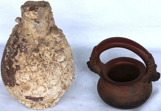 TWO PCS. OF EARLY POTTERY TO INCLUDE: ENCRUSTED REDWARE JAR, AS IS, AND A HANDLED POT WITH GRAPE DESIGN, 6" & 9" H