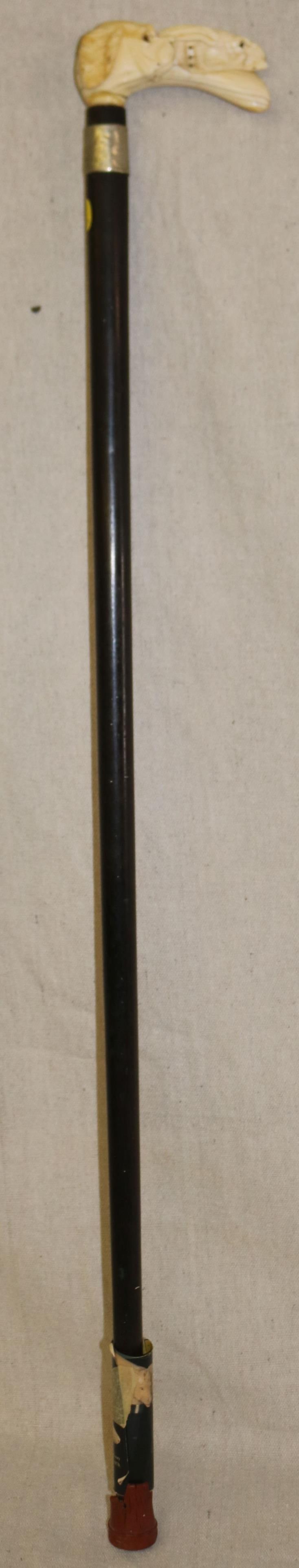 19TH C. CARVED BONE HANDLED CANE WITH DOG &: RABBIT FIGURES, EBONY SHAFT, RABBIT SHOWS CHIP OFF RIGHT SIDE NOSE, 34 1/2" L