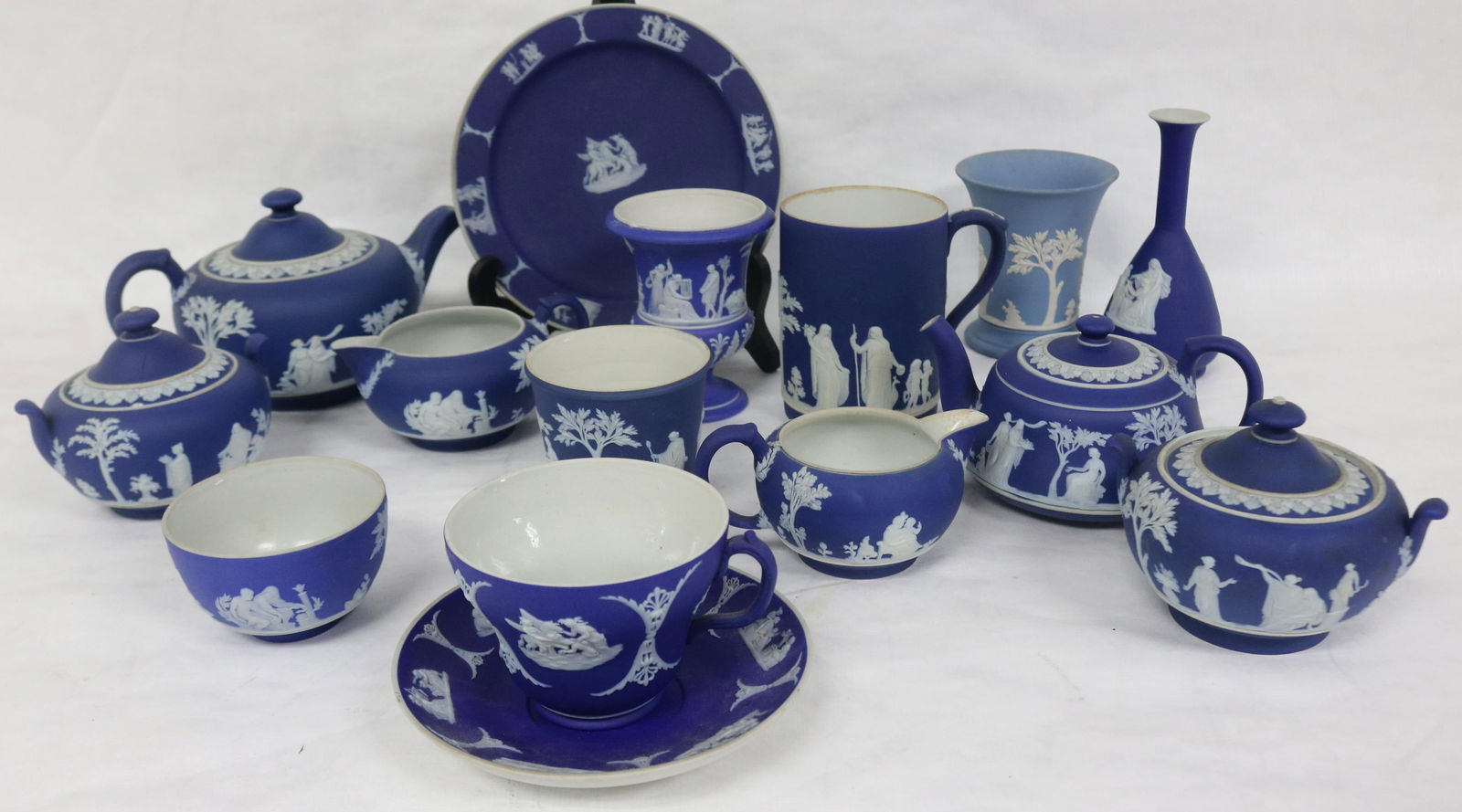 13 PCS. WEDGWOOD JASPERWARE, TWO 3 PC. TEA SETS,: ONE WITH AS IS COVER, PLATE, MUG, URN, 2 VASES, CUP & SAUCER, ETC.