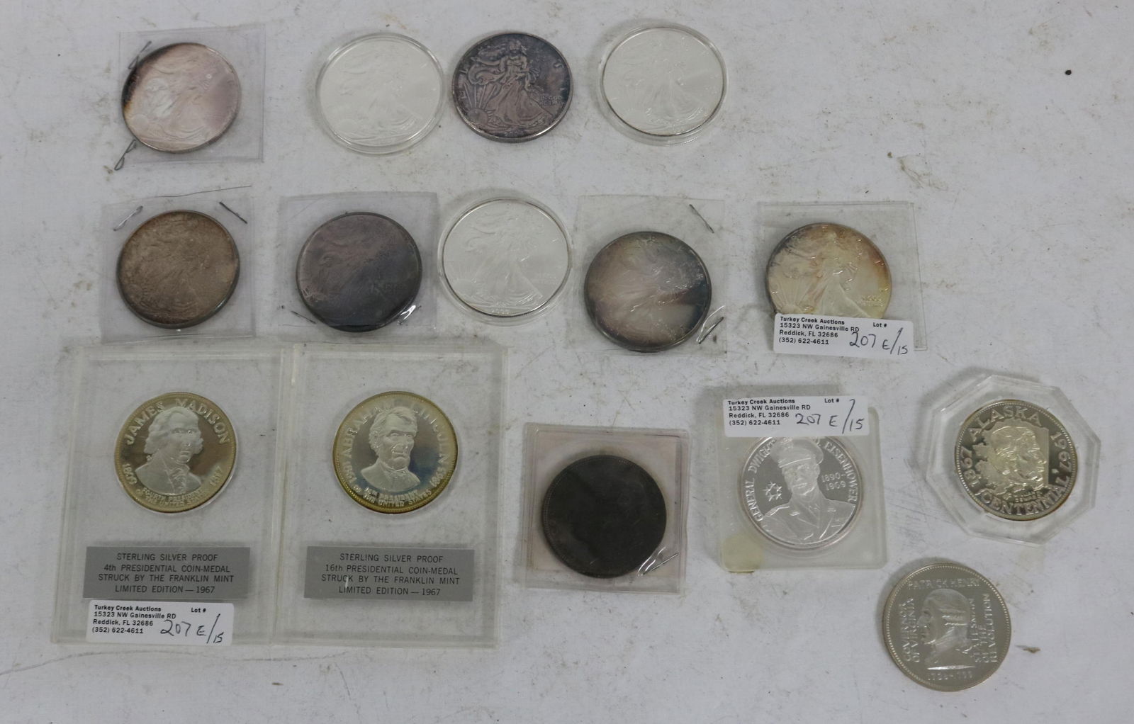 COLLECTION OF 15 SILVER COINS & ROUNDS TO INCLUDE: 9 WALKING LIBERTY 999 COINS, 1999, 2002, 2003, (3) 2004, (3) 2009, 1904 MORGAN AU/UNC, 5 STERLING PROOF COINS, JAMES MADISON, ABRAHAM LINCOLN, PATRICK HENRY, DWIGHT D. EISENHOWER, WILLIAM SEWARD