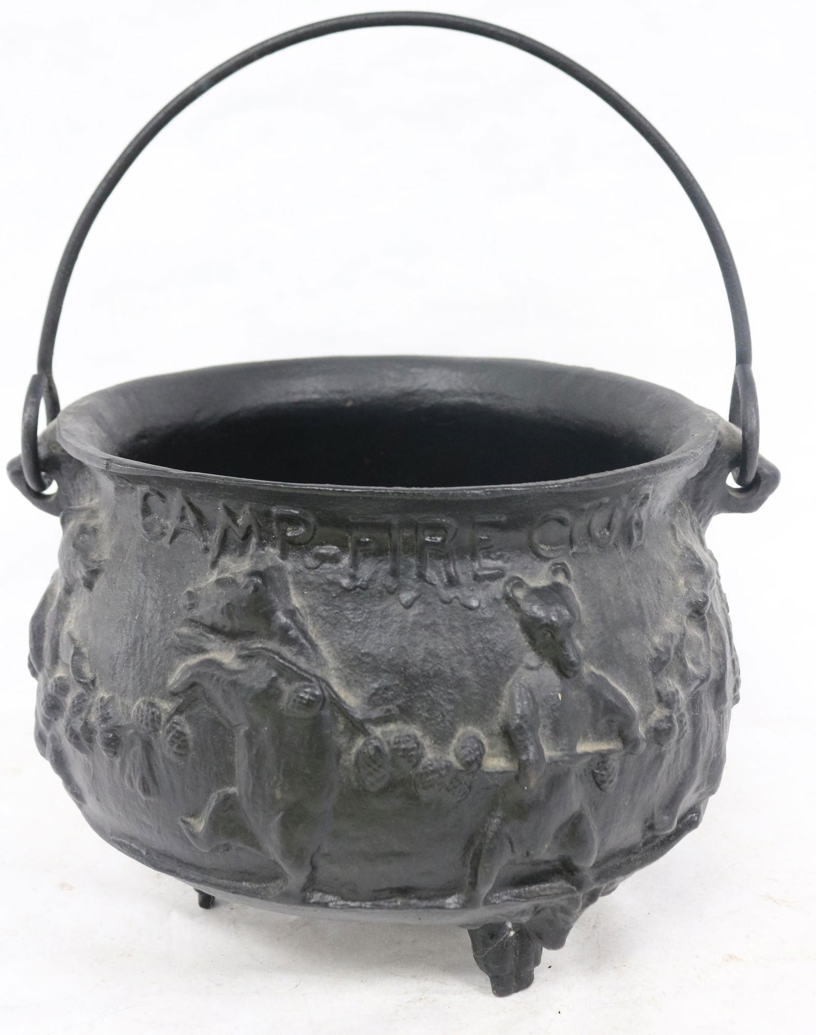 CAST IRON FOOTED POT WITH BAIL HANDLES, EMBOSSED: BEARS WITH MOTTO "KEEP THE FAITH THO I GO EMPTY CAMP FIRE CLUB" 9" H, 12" W, 11" DIA.