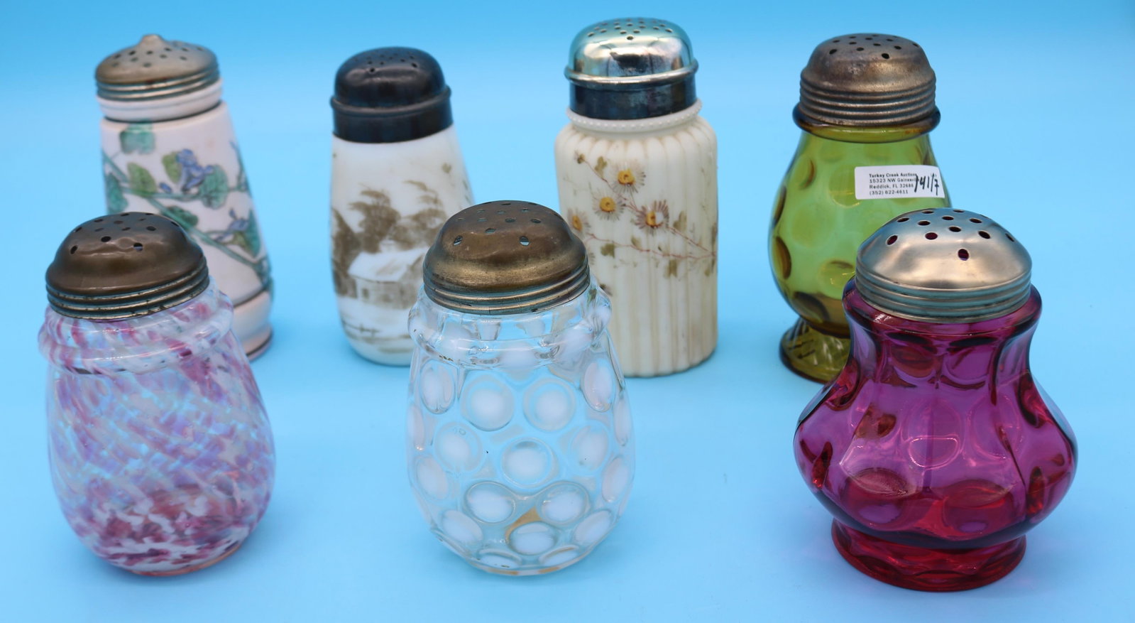 7 GLASS SUGAR SHAKERS, RIBBED MT WASHINGTON 6" H,: CAPE COD GLASS 5" H, OPALESCENT COIN SPOT 4 3/4" H, CRANBERRY & AMBER INVERTED THUMB PRINT 4 3/4" + 5 1/2" H, 3 DECORATED MILK GLASS 5 1/2" - 6" H, NO DAMAGE