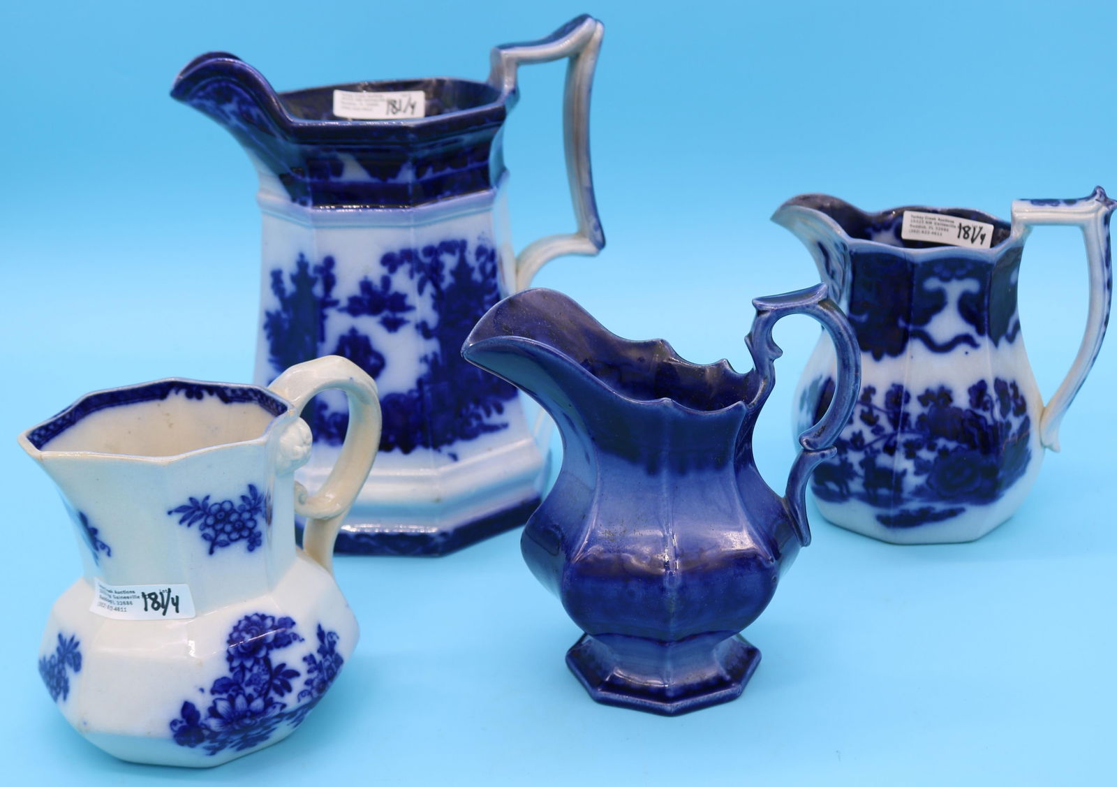 4 19TH C. FLO BLUE PITCHERS & CREAMERS, 4 3/4" -: 8" H, 1 WITH SMALL CHIP & HAIRLINE