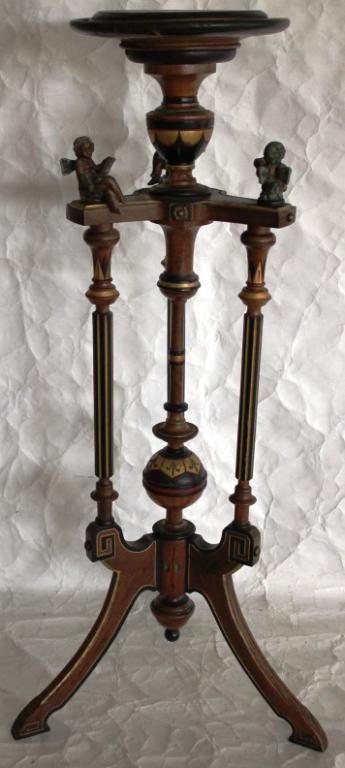 EXCEPTIONAL VICTORIAN WALNUT FERN STAND WITH: EBONIZED GILT AND POLYCHROME DECORATION, METAL CHERUB MOUNTS, 39" H, 18" DIA., TOP DIA. 11"