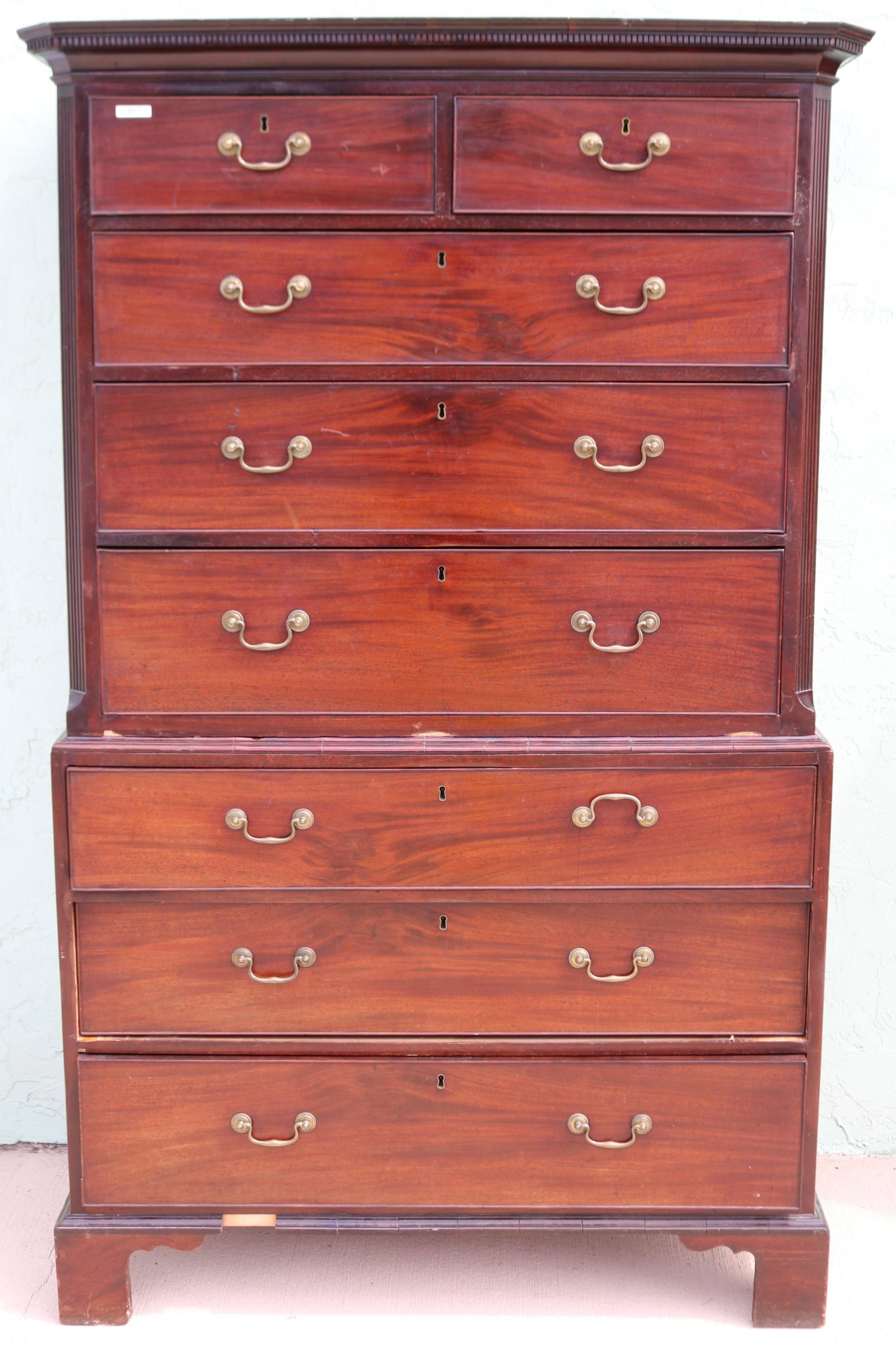 GEORGE III MAHOGANY CHEST ON CHEST, 2 OVER 3 TOP: WITH REEDED COLUMNS, 3 DRAWER BASE ON BRACKET BASE, CLEAN FINISH, MINOR VENEER LOSS, DENTAL MOLDING TOP, BRASS PULLS, 70 3/4" H, 44" W, 23" D