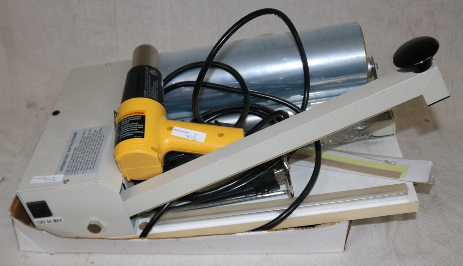 LIKE NEW SHRINK WRAP MACHINE WITH HEAT GUN: SEE PHOTO