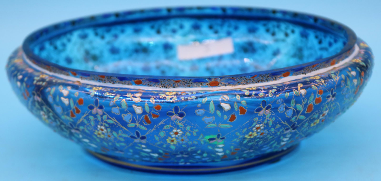 BLUE ENAMELED LOW BOWL, FLORAL DESIGN, MOSER: TYPE, 3" H, 9 1/2" DIA., LOSS TO GOLD GILT ON RIM