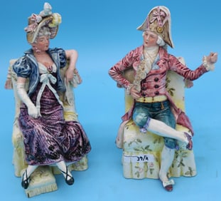 PAIR AUSTRIAN MAJOLICA SEATED FIGURES, MAN &