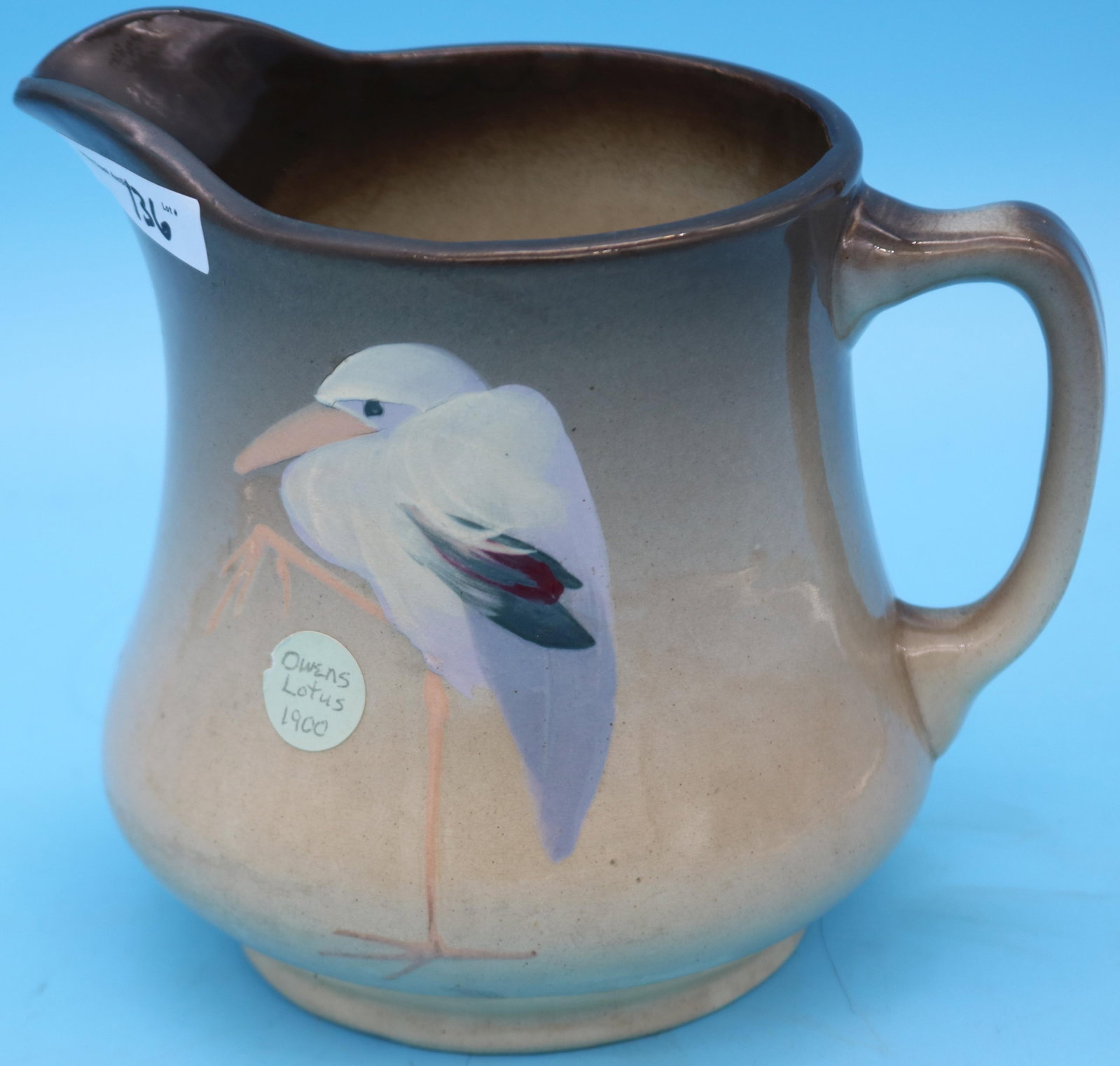OWENS LOTUS HANDLED PITCHER, HIGH GLAZE, BIRD: MOTIF, 8 1/4"