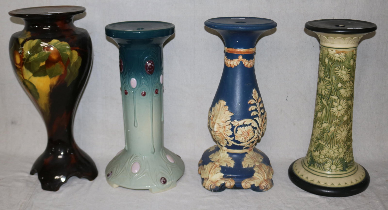 4 WELLER PEDESTALS, MARVO 20 1/4" H, FLEMISH BLUE: 20 3/4" H, CHIPS TO BASE, AURELIAN, REPAIR TO TOP, 22 1/4" H, KNIFE WOOD? 20 1/2" H
