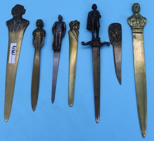 7 BRASS & BRONZE FIGURAL LETTER OPENERS, VARIOUS