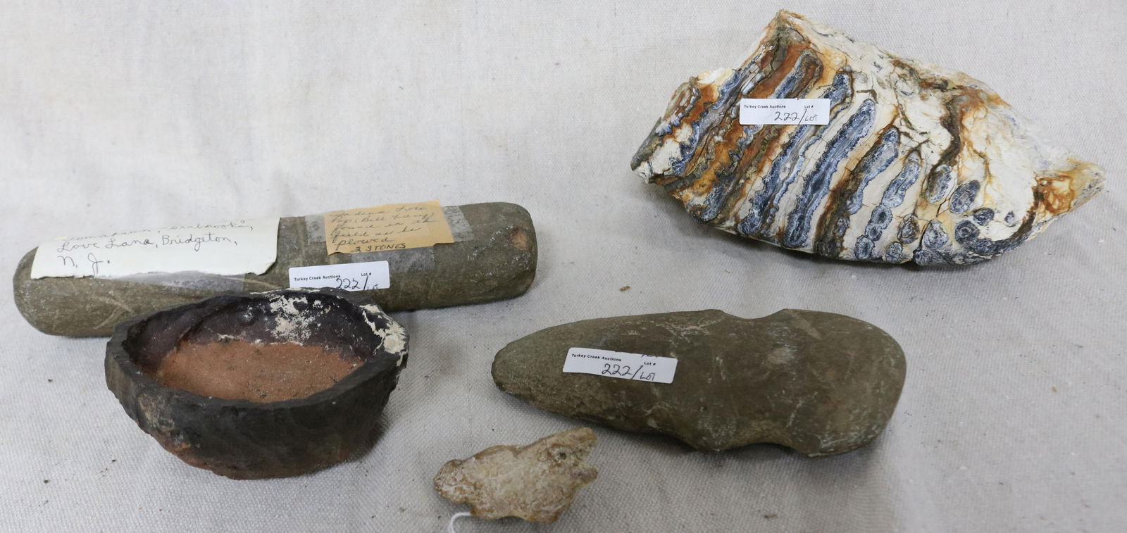 LOT FOSSILS & STONE TOOLS, LARGE MAMMOTH TOOTH,: 5" H, 9 1/2" L, STONE GRINDER 9 1/2" L, AX HEAD, 6 1/2" L, 2 OTHER ITEMS