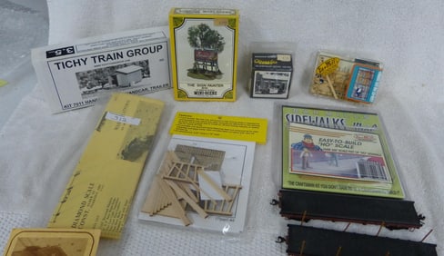 COLLECTION OF HO KITS, SEALED, SOLD AS IS.