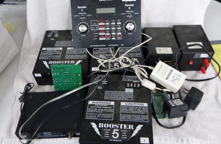 LARGE LOT OF HO TRANSFORMERS-BOOSTERS ETC. SOLD