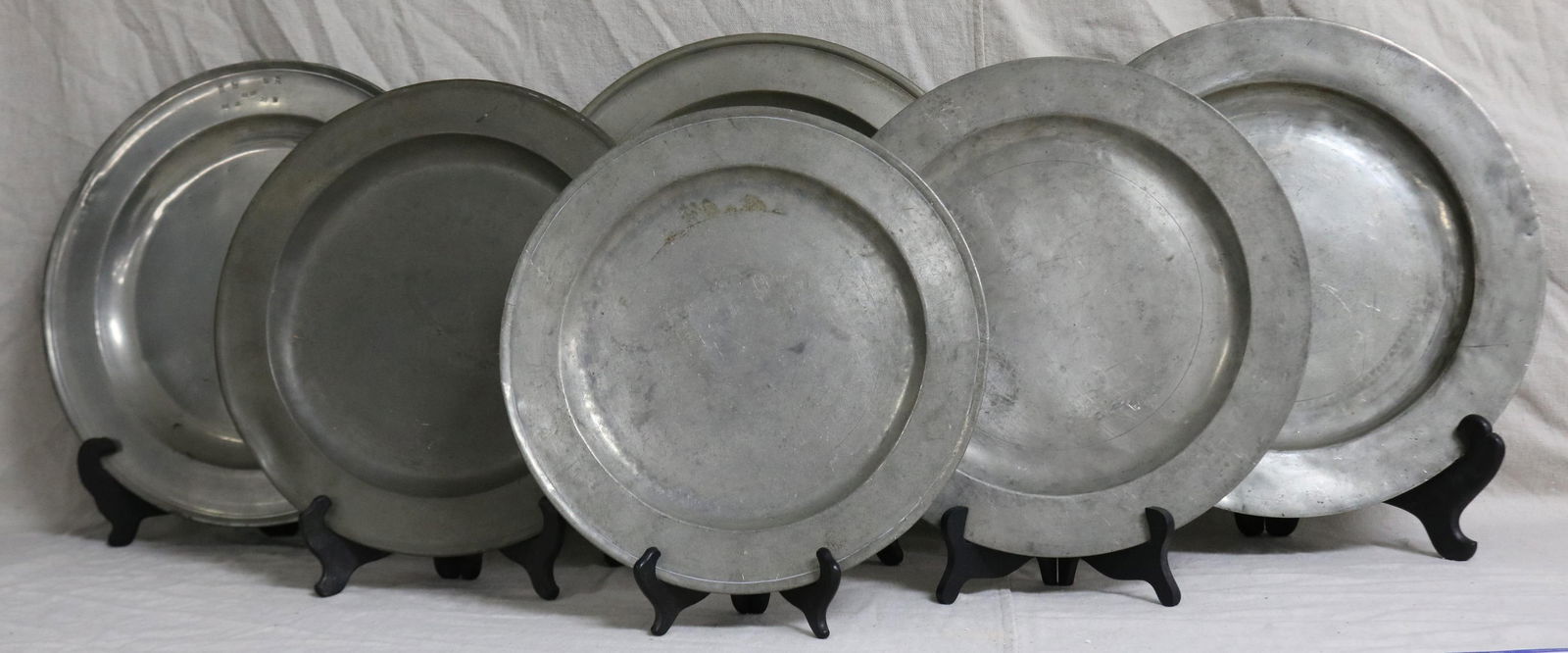 6 PEWTER CHARGERS, LONDON MARKS, 18TH/19TH C., 13: 1/2" - 16 1/2" DIA., SOME DENTS & SCATCHES, AGE APPROPRIATE WEAR