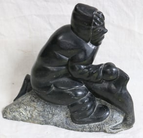 INUIT CARVED FIGURE OF A SEAL HUNTER, SHOWS