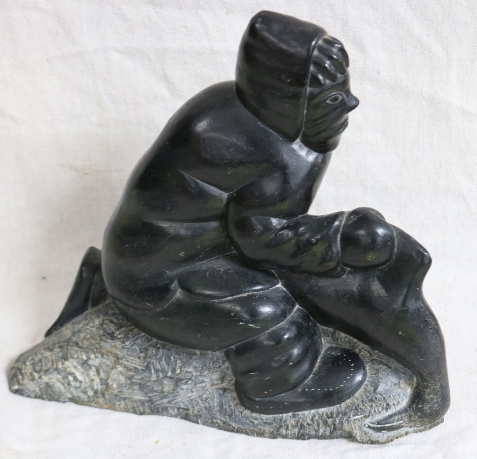 INUIT CARVED FIGURE OF A SEAL HUNTER, SHOWS (1 of 3)