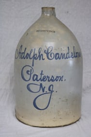 LARGE STONEWARE ADVERTISING JUG, ADOLPH