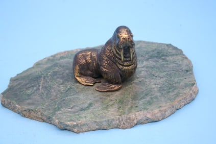 BRASS WALRUS SCULPTURE ON GREEN MARBLE BASE,