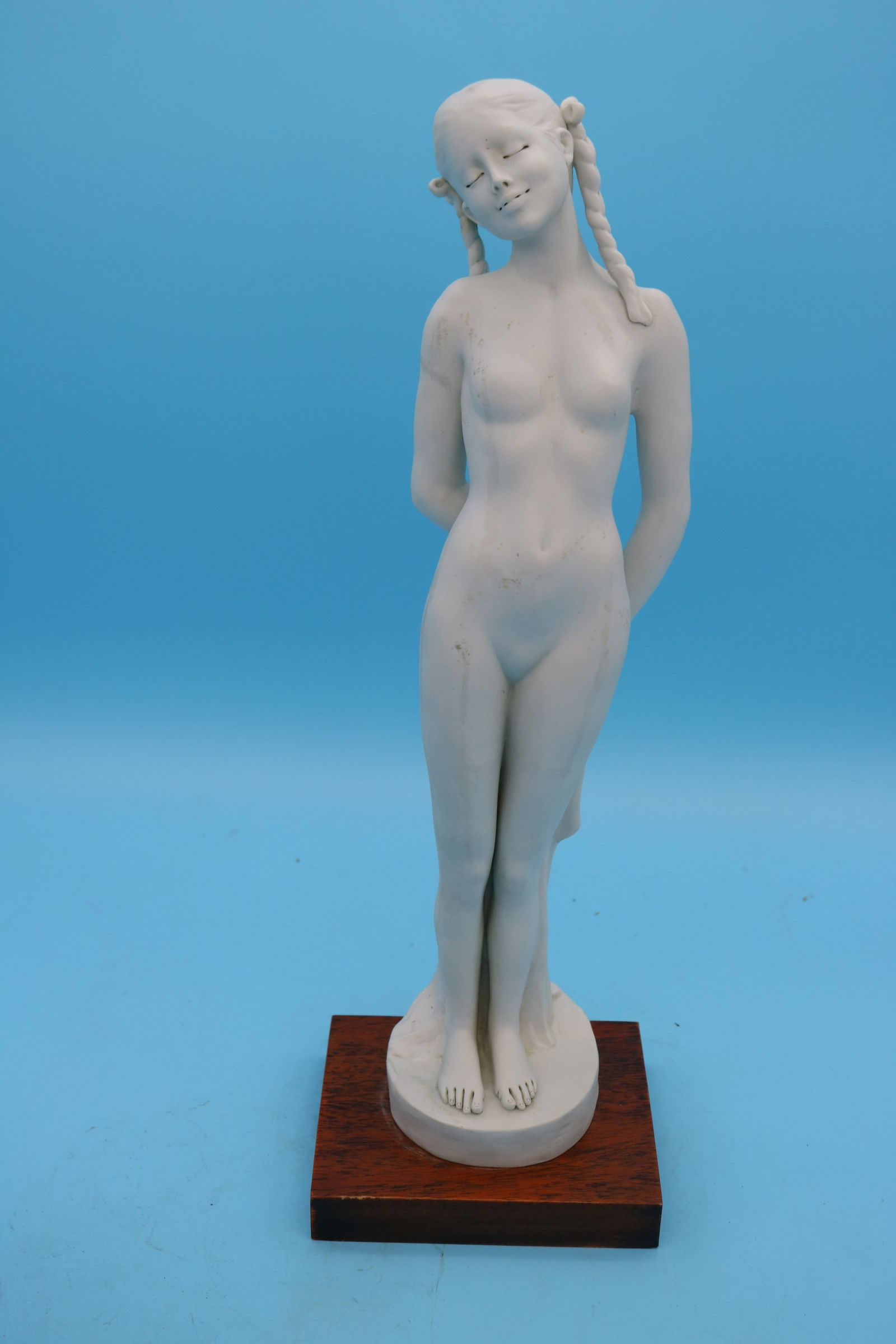 CAPO DI MONTE BISQUE PORCELAIN FIGURE OF STANDING: NUDE GIRL, WHITE BISQUE, SIGNED ILLEGIBLE, 18 1/2" H, 6" W, 5 1/4" D, WOODEN BASE