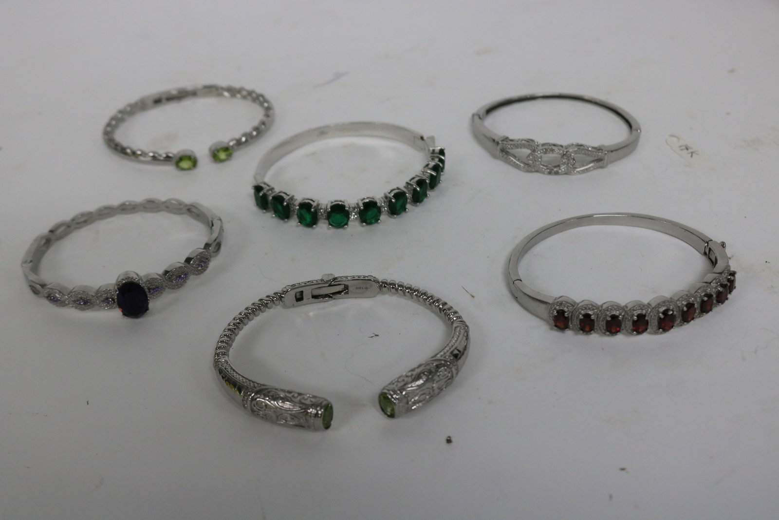 5 STAINLESS STEEL BRACELETS, SOME WITH STONES: SEE PHOTO