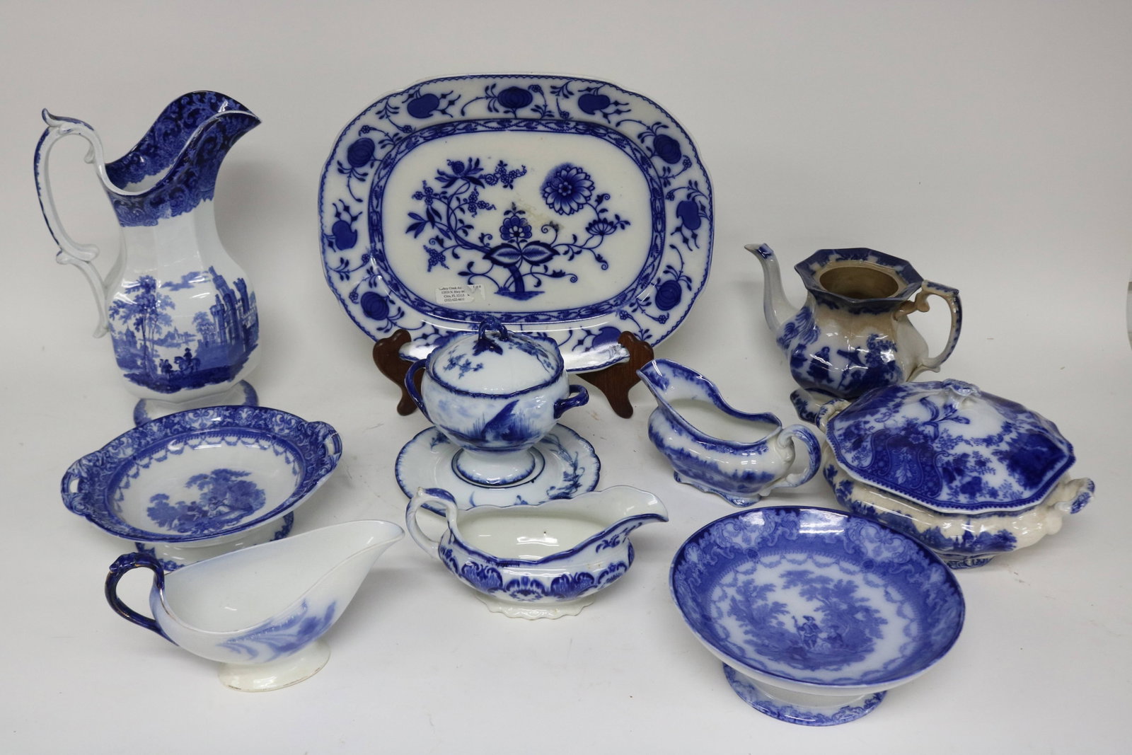 10 PCS. BLUE TRANSFER, ONION PLATTER, 15 1/2" X: 12 1/4", WATTEAU FOOTED COMPOTE, 2 1/2" H, 9 3/4" W, WATTEAU FOOTED COMPOTE, 3 1/4" H, 8 3/4" DIA., 3 GRAVY BOATS, NO PARED, ALTON, ETC. 4" - 5" H, 7 1/2" - 8 3/4" W, SAUCE TURNER WITH COVER & UNDER P