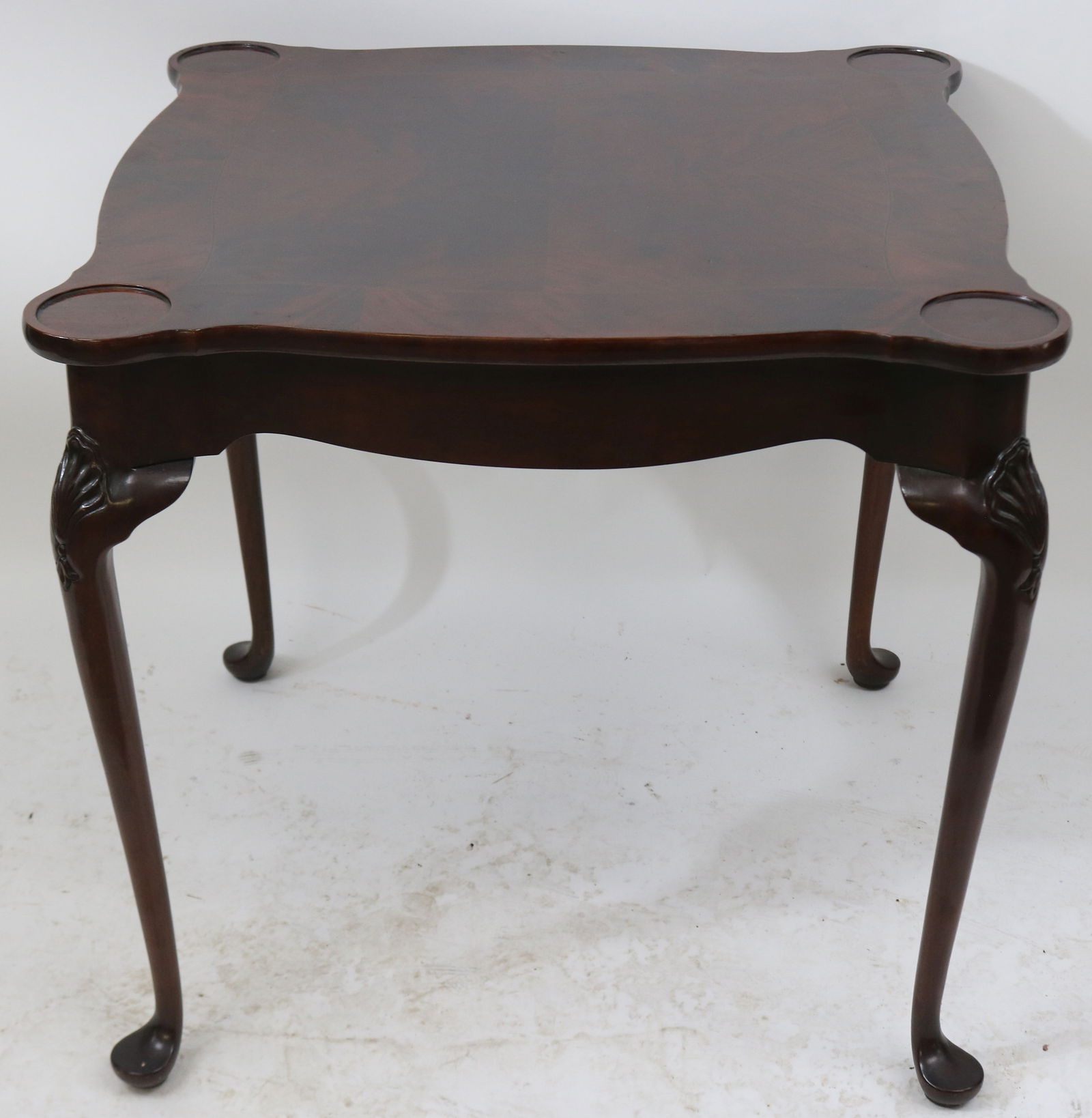 CUSTOM MAHOGANY Q.A. STYLE GAME TABLE, SHAPED TOP: WITH PORRINGER CORNERS, ORIGINAL FINISH, KITTINGER QUALITY, 29" H, 30 1/4" X 30 1/4", SHELL CARVED CABRIOLE LEGS, INLAID CROTCH MAH. TOP