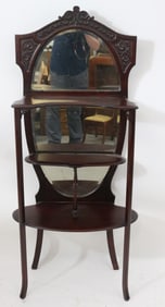 MAHOGANY ETAGERE, OVAL BEVELED MIRROR BACK, SHOWS