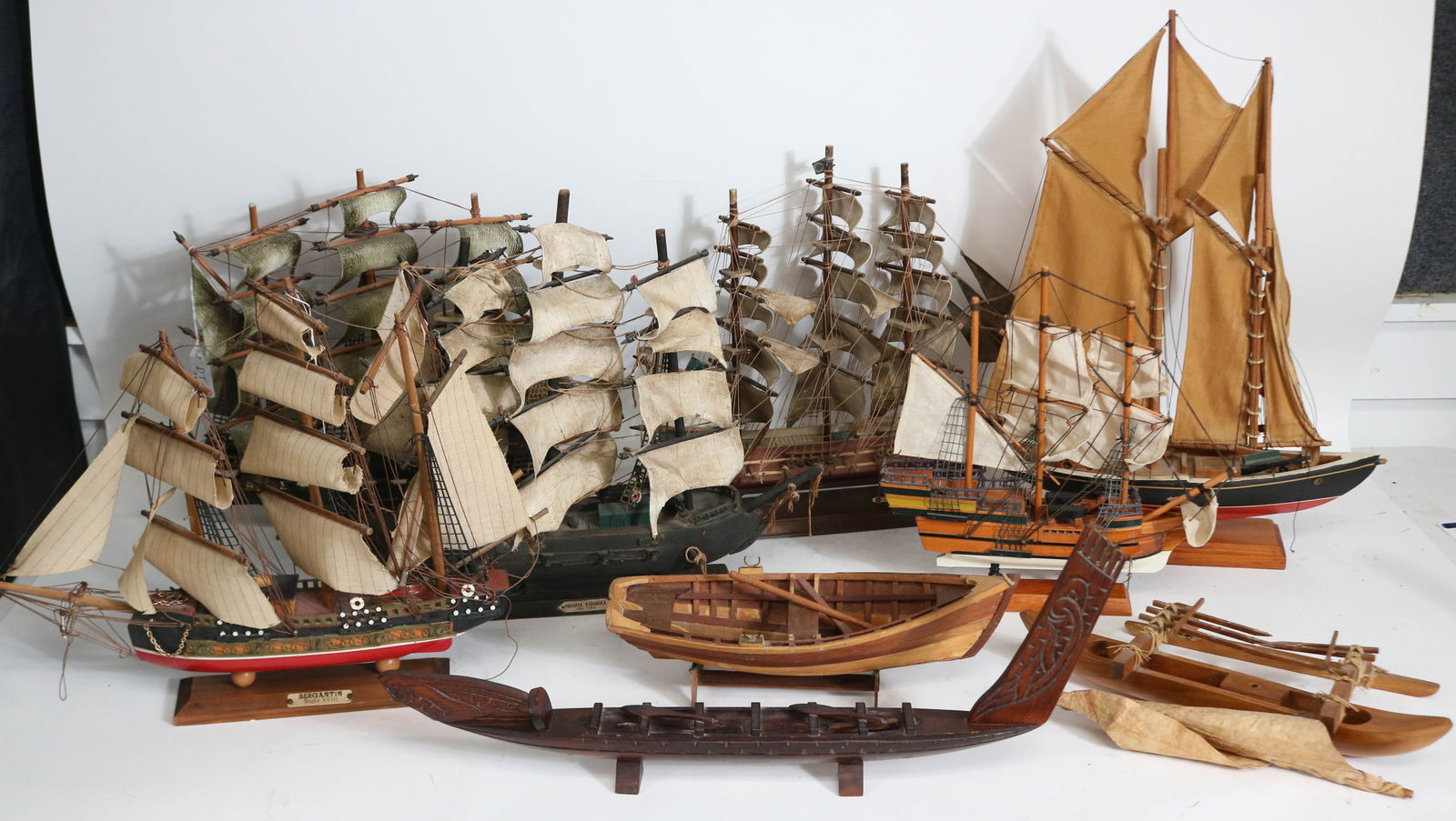 9 MISC. SHIP MODELS, (5) 3 MASTED FRIGATES, 2: MASTED SAIL BOAT, DORY, 2 POLYNESIAN SHIPS, 1 AS IS, 2 1/2" - 20 1/2" H, 13" - 17" W