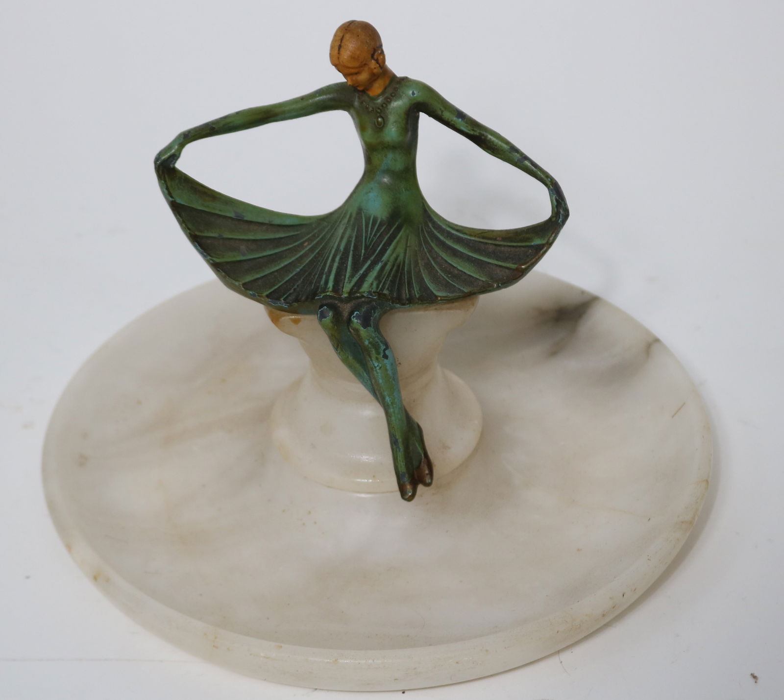 PAINTED METAL ART DECO WOMAN SEATED ON ROUND: WHITE MARBLE TRAY, 6 3/4" H, 8" DIA.