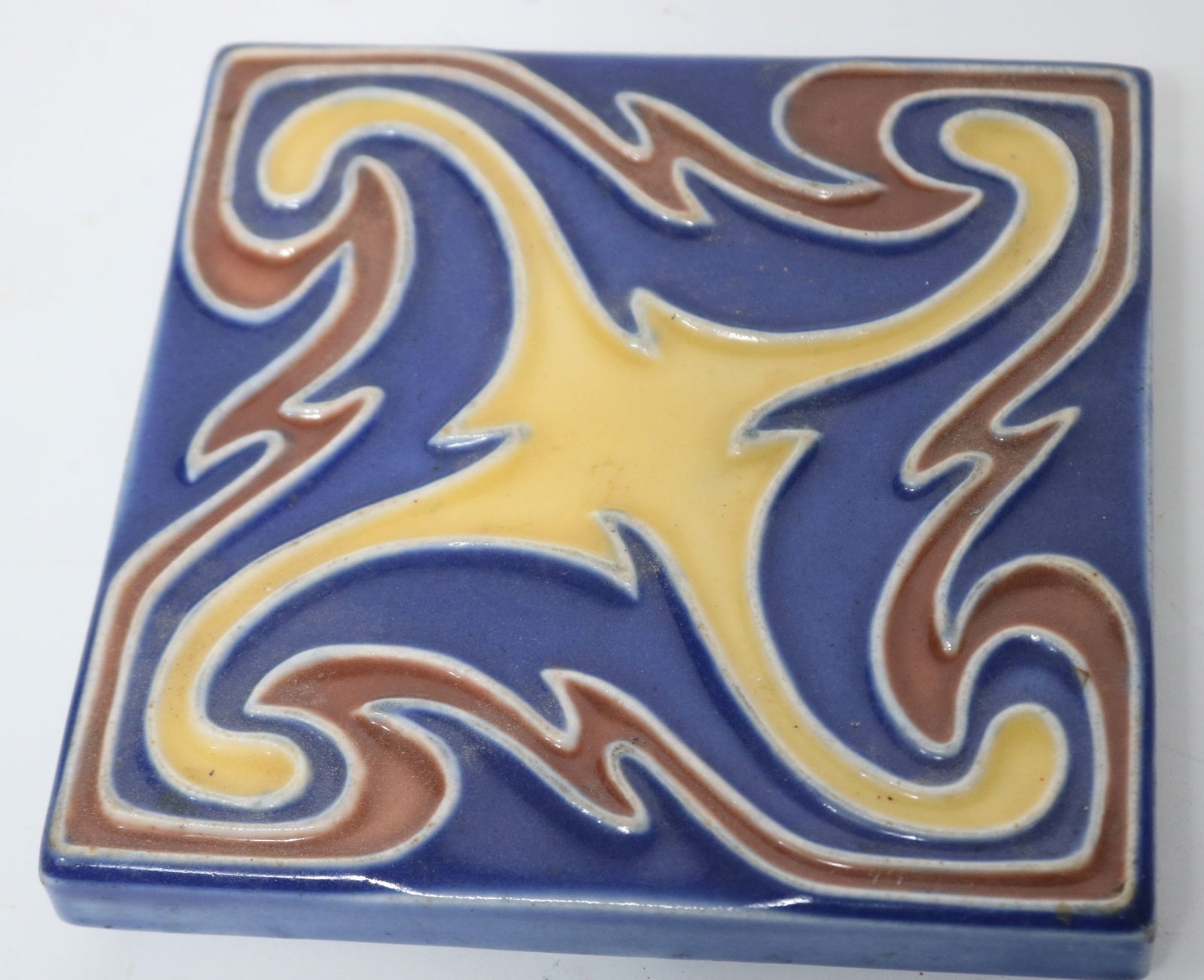 ROOKWOOD TRIVET, 1922, FOOTED, SWIRL DESIGNS, 1": H, 6" X 6"
