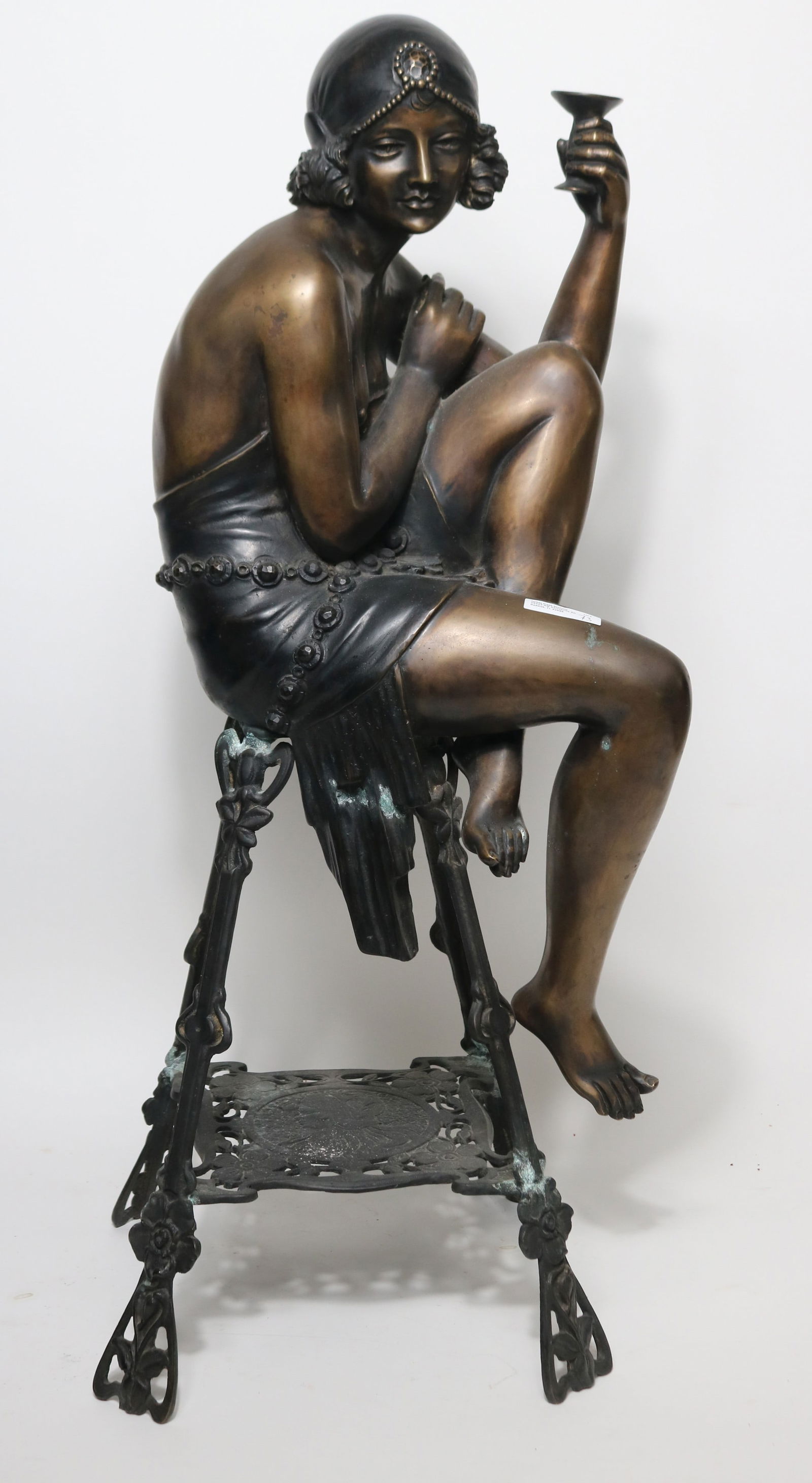 BRONZE FIGURE OF SEATED CHAMPAGNE GIRL, LATE 20TH: C., 31" H, 14" W, 12 1/2" D, SIGNED F. DELUCA,
